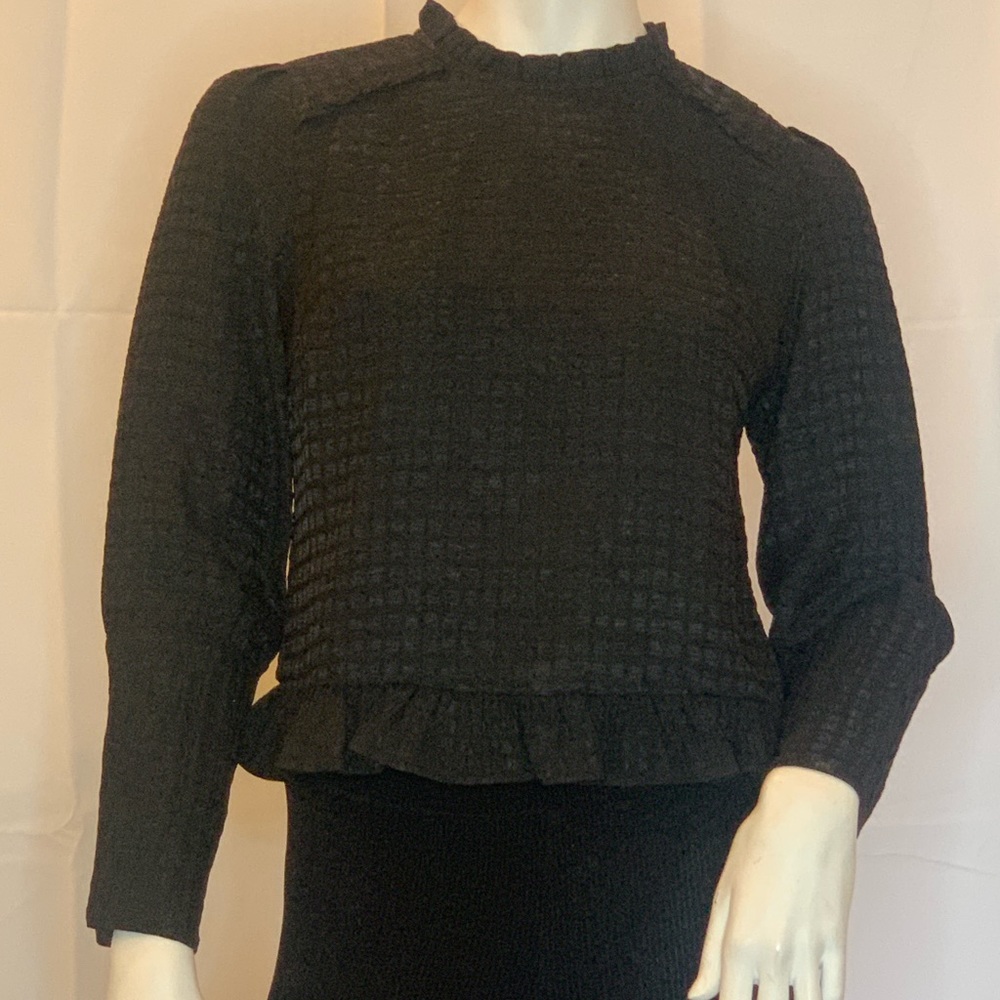 Black ruffled cropped blouse by The Korner